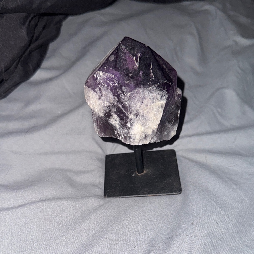 Real amethyst crystal on beautiful stand made in Brazil.